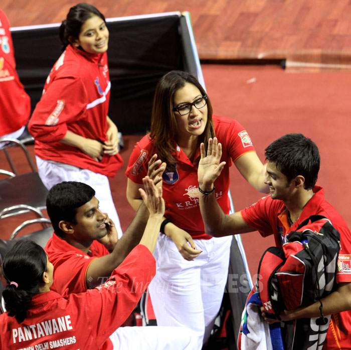 Sai Praneeth of Krrish Delhi Smashers being congratulated by Jwala Gutta and other teammates after he won the match against Nyugen Tien Minh of Pune Pistons during the Indian Badminton League at Sirifort sports complex in New Delhi on Wednesday.
