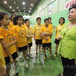 School owner Kamala Thongkorn meets with some of the aspiring badminton players.