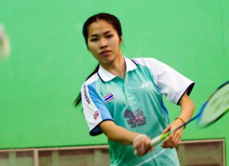In this Friday, Aug. 16,2013 photo, Thailand's Ratchanok Inthanon serves during a training session in Bangkok, Thailand. The Thai teenager last week became the youngest-ever world badminton champion, and the first Thai player to win a world title.