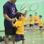 Coach is teaches kids serve Badminton at Intanon’s badminton school