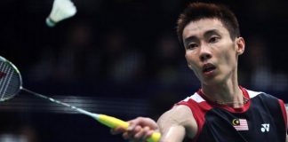 Lee Chong Wei returns to Lin Dan during their men's singles final at World Badminton Championships in Guangzhou, south China's Guangdong province, on August 11, 2013. Lee was later stretchered from the court during the match, with cramp and dehydration, in the latest heartbreaking defeat to his nemesis.