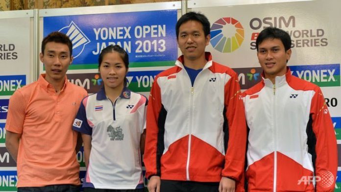 L-R: Badminton players Lee Chong Wei of Malaysia, Ratchanok Intanon of Thailand, and Indonesians Hendra Setiawan and Mohammad Ahsan pose for photos at a press conference in Tokyo, Japan.
