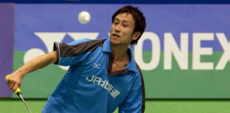 Jun Takemura returning a shot to Hu Yun of Hong Kong, as he went on to win 21-18, 21-17.