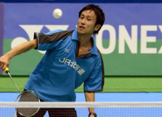 Jun Takemura returning a shot to Hu Yun of Hong Kong, as he went on to win 21-18, 21-17.