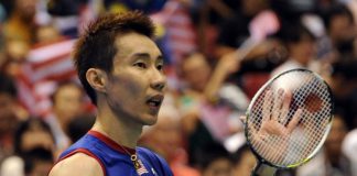 Top-seeded Lee Chong Wei acknowledges the cheers after his victory over Kenichi Tago in the men's singles final match at the Japan Open. Lee won 23-21, 21-17.