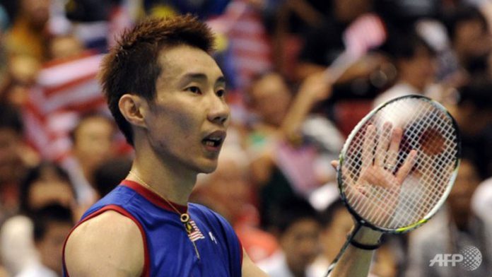 Top-seeded Lee Chong Wei acknowledges the cheers after his victory over Kenichi Tago in the men's singles final match at the Japan Open. Lee won 23-21, 21-17.