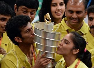 Hyderabad Hotshots player Ajay Jayaram (second from left) and Saina Nehwal (right) kissing the trophy as they celebrate after their team won the Indian Badminton League in Mumbai on Saturday.