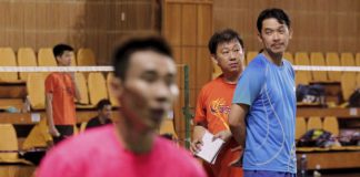 Coaches Rashid Sidek (right) and Tey Seu Bock keeping an eye on Lee Chong Wei and other players at the Juara Stadium.