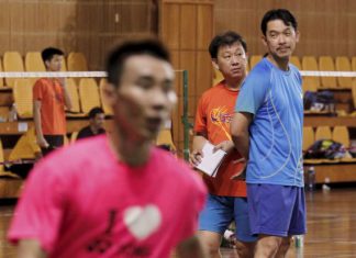 Coaches Rashid Sidek (right) and Tey Seu Bock keeping an eye on Lee Chong Wei and other players at the Juara Stadium.
