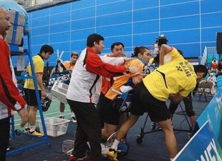 Coaches desperately try to break up the remarkable brawl between the two badminton players during the doubles final of the Canada Open in July