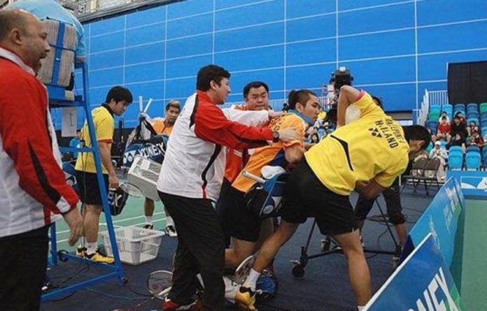 Coaches desperately try to break up the remarkable brawl between the two badminton players during the doubles final of the Canada Open in July