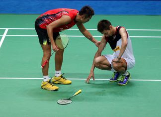 Lee Chong Wei (right) seen here being comforted by China's Lin Dan after the former suffered serious cramping in the final of the World Championships in August, may finally get some much needed rest as a niggling ankle injury may see him skip the final three tournaments of the year.