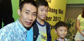 Lee Chong Wei takes a photo with young fans Lim Yu Hong, 10, and Lim Yu Ming, 7, at an autograph session at the Malaysia Sports & Health Fair 2013. He will be skipping the China Open to allow his ankle to heal but hopes to make it to the Hong Kong Open and the Super Series Finals.