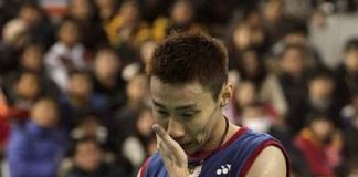 Malaysia's Lee Chong Wei looks down after losing a point against China's Chen Long during their men's singles final match at the Korea Open Badminton tournament in Seoul, South Korea, Sunday, Jan. 12, 2014. Chen won the match 21-14, 21-15.
