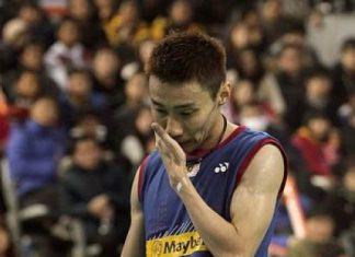Malaysia's Lee Chong Wei looks down after losing a point against China's Chen Long during their men's singles final match at the Korea Open Badminton tournament in Seoul, South Korea, Sunday, Jan. 12, 2014. Chen won the match 21-14, 21-15.