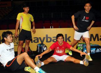 World champion men's doubles pair, Mohd Ahsan (2nd right) and Hendra Setiawan (right) warm down after a training session for the Malaysian Open badminton championship beginning on Wednesday at Bukit Jalil.