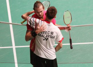 Lee Chong Wei consoles his semi-final opponent from Denmark Jan O Jorgensen after latter retired injured from their match at Putra Stadium on Saturday.