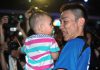 A beaming Lee Chong Wei carries his son, Kingston, after winning the Malaysian Open badminton championship title for the 10th time on Sunday at Putra Stadium in Bukit Jalil.