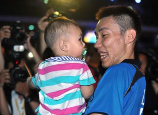 A beaming Lee Chong Wei carries his son, Kingston, after winning the Malaysian Open badminton championship title for the 10th time on Sunday at Putra Stadium in Bukit Jalil.
