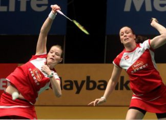 Danish pair Christinna Pedersen (left) and Kamilla Rytter Juhl return a shot to Korean pair Chae Yoo Jung-Kim Ji Won during their first-round match in the Maybank Malaysian Open on Jan 15, 2014. The Danish pair won 16-21, 21-11, 21-17.