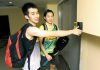 National shuttlers Chong Wei Feng (left) and Ho Yen Mei using the thumb print access system before entering Stadium Juara for training.
