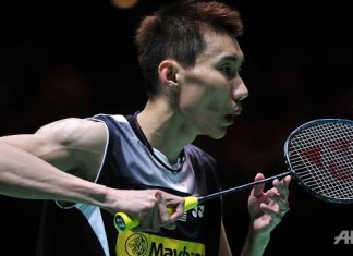 Lee Chong Wei of Malaysia prepares to return against Son Wan Ho of South Korea during their All England Open Badminton Championships men's singles semi-final match in Birmingham, central England.