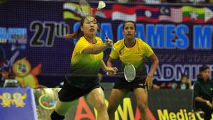Singapore's Yao Lei (L) and Shinta Mulia Sari during the badminton women's doubles quarter final round at the 27th SEA Games in Myanmar on 12 Dec 2013.