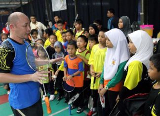 Former national chief coach and player Yap Kim Hock, seen here with kids from Pandamaran at his badminton academy, has applied for the men's doubles coaching position with BAM on Friday.