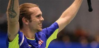 Jan O Jorgensen waves to the crowd after defeating Lin Dan 19-21, 21-13, 16-21 in the quarter final of Japan Open