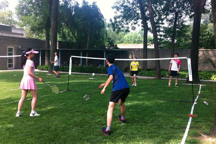 The Danish Badminton Inspiration Team plays a friendly match with Chinese social media users on the outdoor badminton courts at the Danish Embassy in Beijing