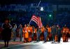 Flag bearer and Cyclist Fatehah Mustapa of Malaysia flies the flag at half mast during the Opening Ceremony for the Glasgow 2014 Commonwealth Games at Celtic Park on July 23, 2014 in Glasgow, Scotland. Quinn Rooney/Getty Images