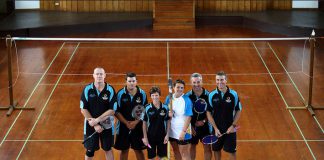 The Norfolk Island Badminton Team hold the Queen's Baton in the badminton court in Norfolk Island on Sunday 22 December 2013.