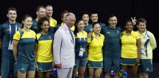 Prince Charles poses with members of the Australia badminton team in the lead up to the Games.