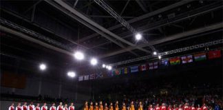 England, Malaysia, Singapore (from left) stand on podium for national anthem of Malaysia - "Negaraku"