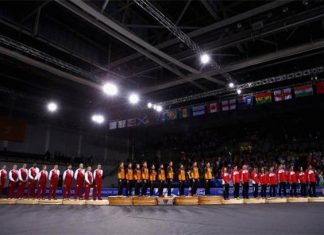 England, Malaysia, Singapore (from left) stand on podium for national anthem of Malaysia - "Negaraku"