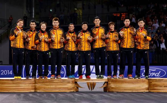 Malaysia shuttlers stand on the podium