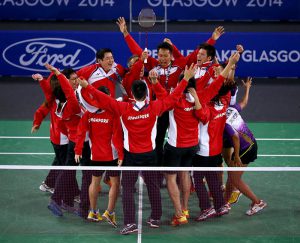 Singapore players storm the court to celebrate their bronze medal victory