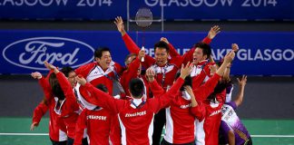 Singapore players storm the court to celebrate their bronze medal victory