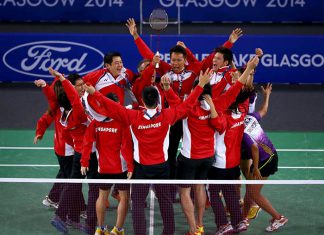 Singapore players storm the court to celebrate their bronze medal victory