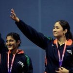 Jwala Gutta (right) and Ashwini Ponnappa wave after winning gold in the women’s badminton doubles event of Commonwealth Games in New Delhi on October 14, 2010.