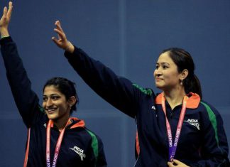 Jwala Gutta (right) and Ashwini Ponnappa wave after winning gold in the women's badminton doubles event of Commonwealth Games in New Delhi on October 14, 2010.