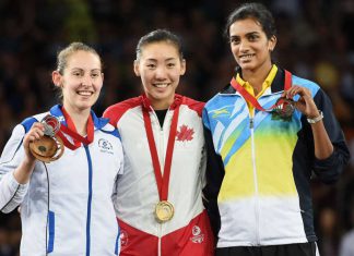 Canada's Michelle Li, gold medallist, is flanked by Scotland's Kirsty Gilmour, left, silver medallist, and India's PV Sindhu, right, bronze medallist, after the women's singles badminton final at the Commonwealth Games in Glasgow, Scotland on Sunday, August 3, 2014.