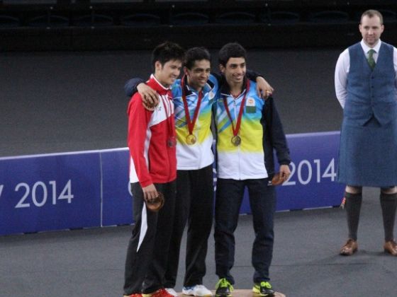 Derek Wong (L) poses with India's Kashyap Parupalli and R V Gurusaidutt after they receive their medals for the men's singles badminton finals at the Commonwealth Games in Glasgow. (Photo: Commonwealth Games Singapore)
