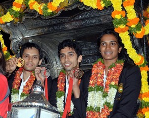 Kashyap, Guru and Sindhu and return home to hero's welcome