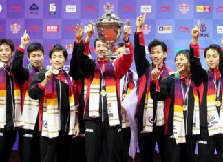Japan head coach Park Joo-bong holds aloft the Thomas Cup after they beat Malaysia 3-2 in the Thomas Cup final in New Delhi last May.