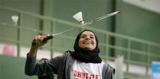 A female player practices for the Shuttle Time Dubai Open badminton tournament