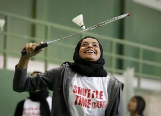 A female player practices for the Shuttle Time Dubai Open badminton tournament