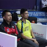 Hafiz (yellow shirt) sits next to his brother Muhammad Roslin Hashim at the Purple League