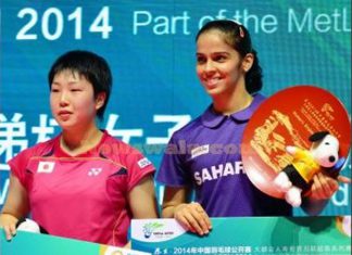 Indian shuttler Saina Nehwal winning her maiden China Open Super Series Premier women's singles title against Japan's Akane Yamaguchi (left) in Fuzhou, China on Nov 16, 2014.