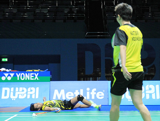 Down and out: Tontowi Ahmad (left) lies on the floor while his partner Liliyana Natsir stands in front of him after their defeat by Danish players Joachim Fischer Nielsen and Christinna Pederson during their mixed doubles match at the BWF Super Series Finals 2014 in Dubai, United Arab Emirates, earlier this month. The top Indonesian players packed their bags early after their exit. Badmintonindonesia.org